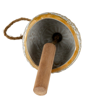 Overhead view into the ceramic bell showing the wooden clapper and internal textured glaze.