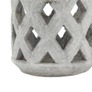 Detail of the rough ceramic base where the diamond lattice pattern joins the solid rim.
