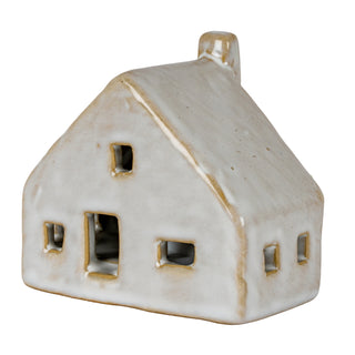 Three-quarter view of the pale grey ceramic cottage decoration with rustic glaze and rectangular openings.
