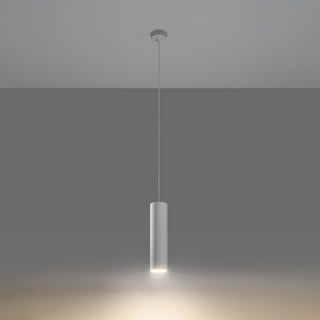 White ceramic cylindrical pendant light suspended, emitting a warm, focused beam downwards.