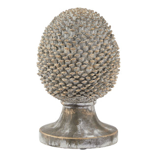 Front-on view of the textured ceramic pinecone ornament on a pedestal base. Distressed grey finish with gold detailing.