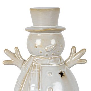 Detailed view of the ceramic snowman's glazed head, top hat, stick arms, and upper body with a star cutout.