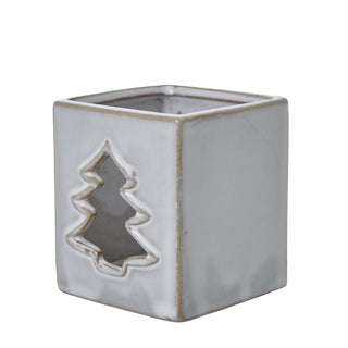 Three-quarter view of the square ceramic tealight holder, showing the tree cut-out and the rustic glaze detail on the edges.