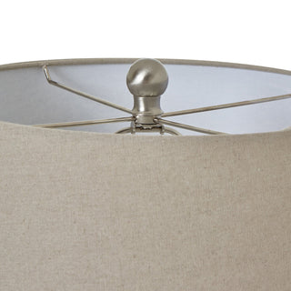 Close detail of the beige linen shade fabric, showing the metal spider frame and spherical finial.