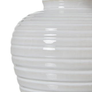 Close detail of the white ceramic base, highlighting the ribbed texture and glossy glaze finish.