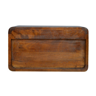 Bottom panel of the chestnut bedside unit highlighting the dark wood grain and rounded corners.