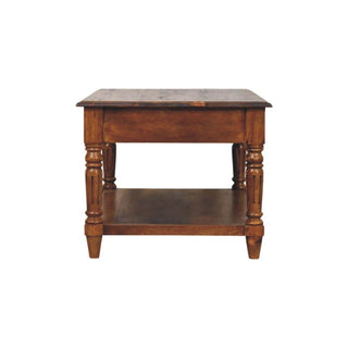 End profile of the chestnut coffee table showing the turned legs and lower storage shelf.