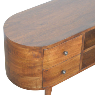 Rounded end of the entertainment unit, highlighting the wood texture, curved side, and two stacked drawers.