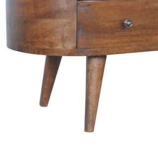 Close-up of the chestnut unit's rounded base and two tapered wooden legs.