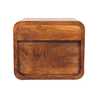 Front view of the chestnut floating bedside unit, showing the rounded edges and recessed drawer panel.