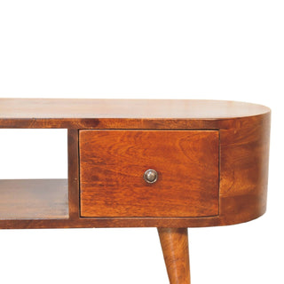 Close-up detail of the chestnut unit showing the rounded end, drawer, metal knob, and tapered leg.