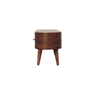 Side view of the chestnut media unit, illustrating the depth, rounded edges, and tapered wooden legs.