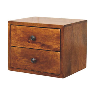 Angled view of the two-drawer chestnut nightstand showing the dark metal circular handles.