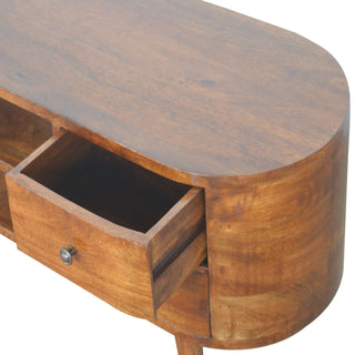 Close-up of the chestnut unit's rounded end, showing the oval top and one drawer pulled open.