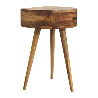 Circular wooden nightstand showing the light brown wood grain, a prominent knot, and three angled tapered legs.