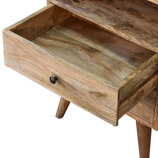 Close-up of the oak-ish bedside table with the top drawer fully open, highlighting the interior storage.