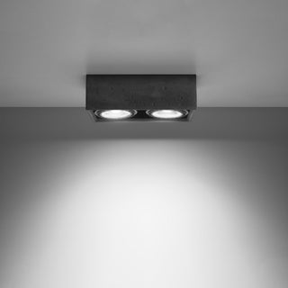 Downward view showing the two spotlights casting a wide, bright beam of light below.