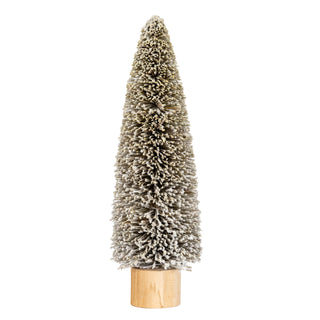 Front-on view of a tall, flocked bottle brush cone tree decoration on a natural wooden base.