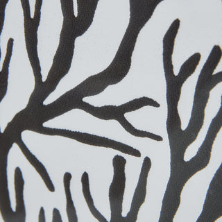 Close detail of the black coral silhouette branches printed on a white textured surface.