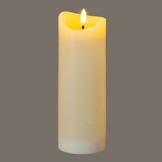 Cream LED candle illuminated, highlighting the warm glow emanating from the faux flame and the melted wax top.