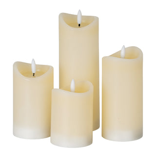 Grouping of four cream LED candles in various heights and widths, all featuring a melted wax top.
