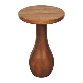 Angled view of the wooden side table showing the grain texture and the bulbous lower base.