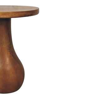 Close profile shot highlighting the vase shape of the wooden base and the smooth, dark wood finish.