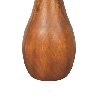 Extreme close-up of the smooth, curved wooden base showing the rich grain pattern.