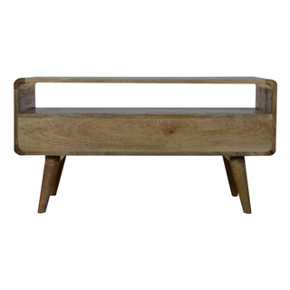 Plain studio shot of the curved oak-ish media unit with open storage and tapered legs.