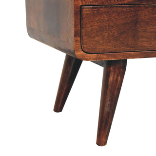 Close-up showing the two tapered legs attached to the curved base of the walnut media unit.