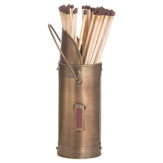 Cylindrical bronze match holder with a handle and striking plate, filled with wooden fireside matches.