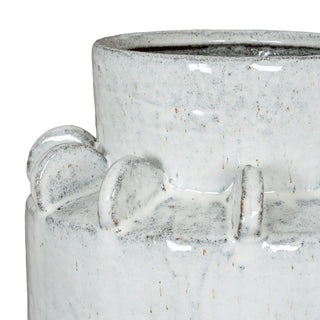 Textured detail of the vase showing the speckled ceramic finish and thick white glaze application.