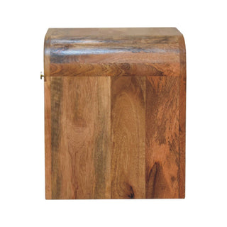 Full side profile of the wooden bedside table, showing the depth and the continuous curved top edge.