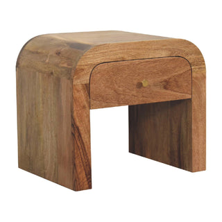 Three-quarter view of the wooden bedside table, showing the natural grain and colour variation of the timber.