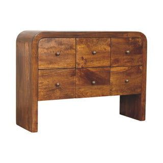 Chestnut finish chest of drawers showing the dark wood grain, six drawers, and antique brass knobs.