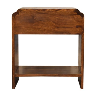 Back view of the dark wood bedside cabinet showing the scalloped top edge of the rear panel.