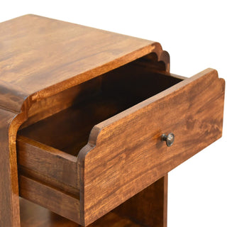 Detail shot of the dark wood bedside table with the single drawer open, showing the internal box construction.