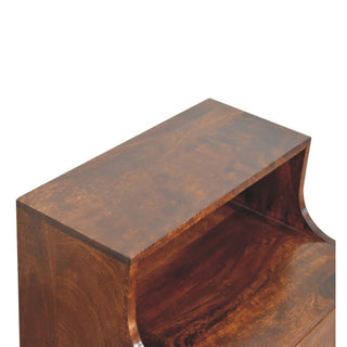 Detail shot of the polished dark wood surface and open storage shelf, highlighting the rich grain.