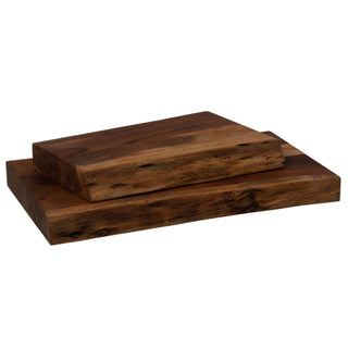 Stacked dark wood chopping boards showing the thick profile and natural live edge along the side.