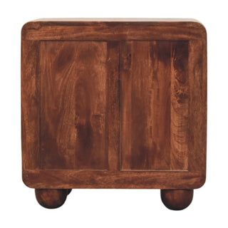 Rear view of the dark wood chest showing the back panel construction and spherical feet.