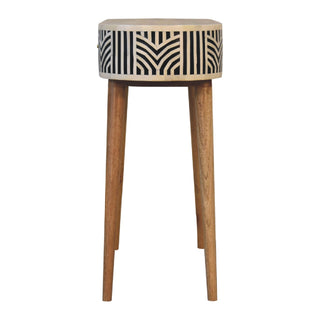 Front view of the console table showing the geometric bone inlay drum and tall tapered wooden legs.