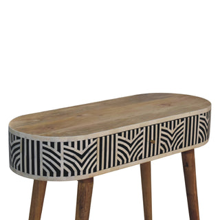 High-angle view of the oval console table top showing the natural wood grain and curved bone inlay apron.