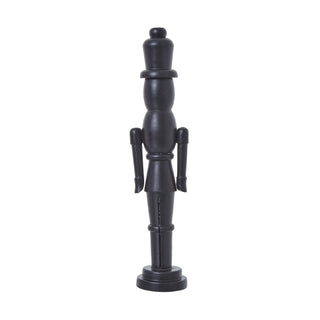 Full view of the elegant black wooden nutcracker ornament against a white background.
