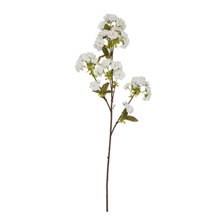 Full length view of the artificial white blossom stem with green leaves, isolated on a white background.