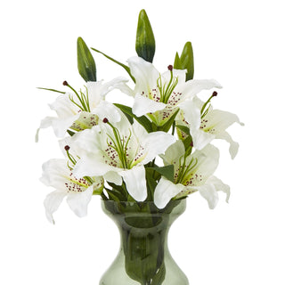 Front view of the artificial lily spray showing six open flowers and three closed buds in a grey-green vase.