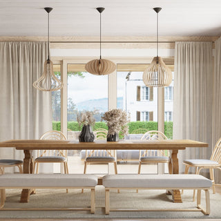 Three wooden slatted pendant lamps hanging over a light wood dining table in a neutral-toned room.