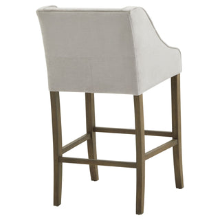 Rear view of the grey fabric barstool showing the panelled back detail and the dark wood leg structure.