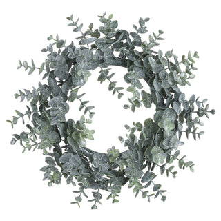 Circular artificial eucalyptus wreath with frosted, dusty green leaves, shown front-on against white.