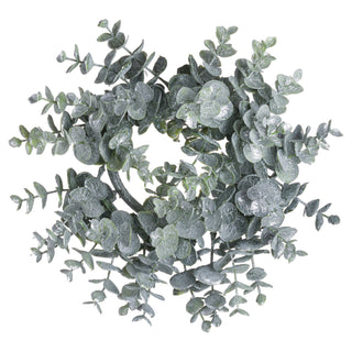 Plain top-down studio shot of the circular eucalyptus candle wreath with frosted green leaves.