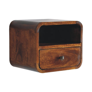 Curved chestnut bedside unit shown floating, highlighting the rich wood grain and dark finish.